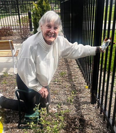Resident gardening in an outdoor space