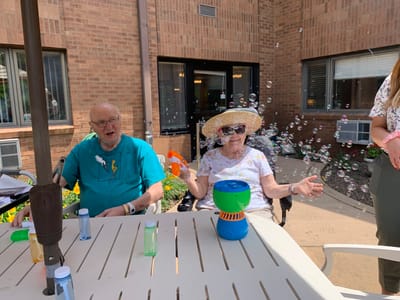 Residents enjoying bubble play outside