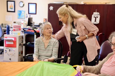 Staff engaging with residents during an activity