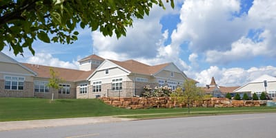 Exterior view of a senior living campus with landscaping