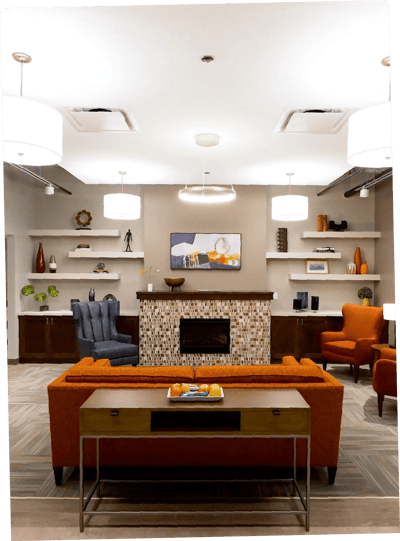Cozy common area with seating and decorative fireplace