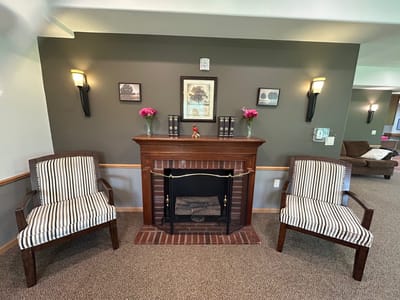 Interior common area with chairs and fireplace