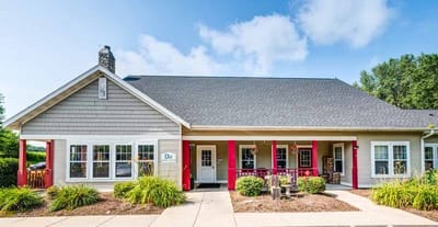 Exterior view of a senior living facility with landscaping