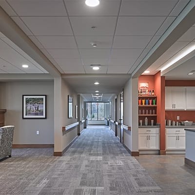 Bright interior corridor with seating and decor