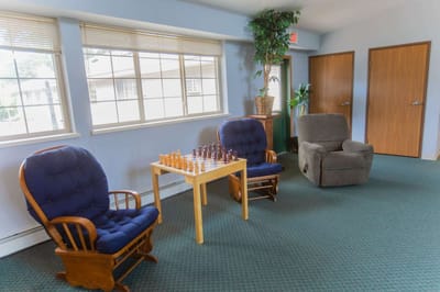 Interior common area with seating and chess set