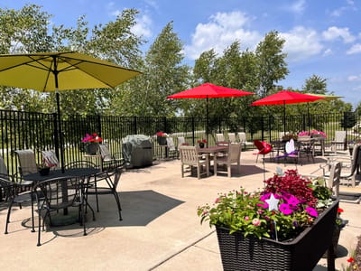 Outdoor seating area with umbrellas and flowers