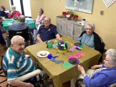 Residents engaging in a festive activity with decorations