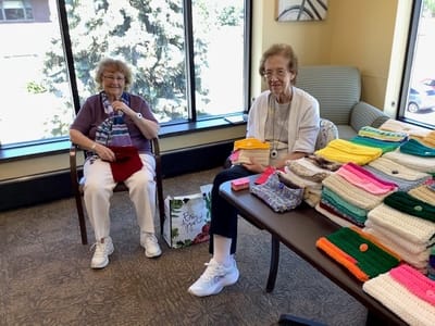 Residents engaged in a crafting activity at the facility