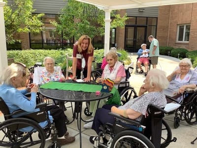 Residents enjoying an outdoor activity with staff