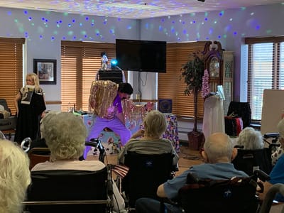 Residents enjoying a live performance in an activity room