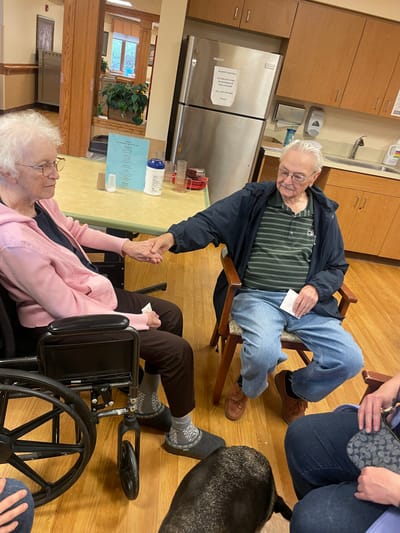Residents sharing a moment in a cozy common area