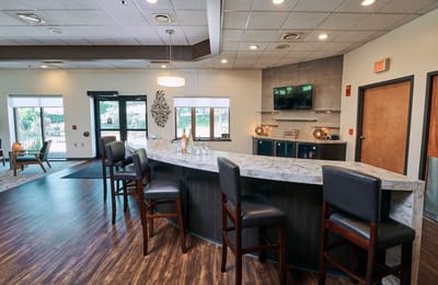 Modern common area with a bar and seating