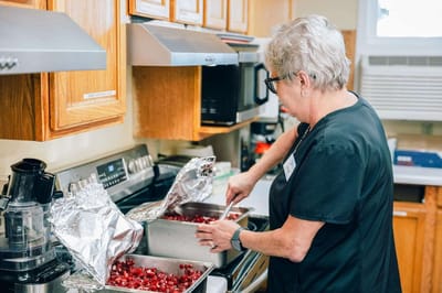 Staff member cooking in the kitchen