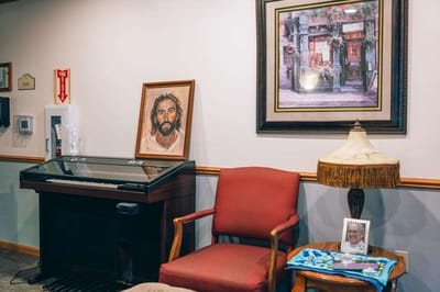 Cozy interior space with piano and artwork