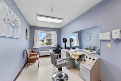 Hair salon area with styling tools and chairs