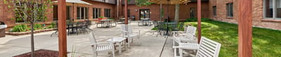 Outdoor seating area with tables and chairs
