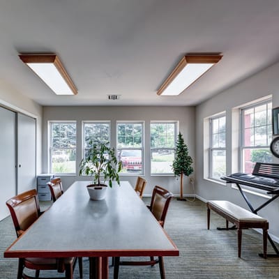 Bright common area with a table and chairs