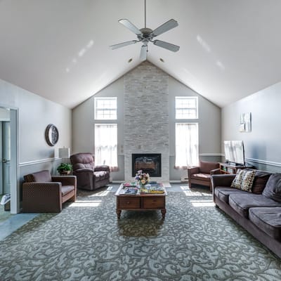 Bright common area with comfortable seating and fireplace