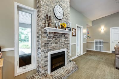Cozy interior with a brick fireplace and decorations