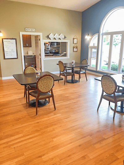 Dining area with tables and chairs in a bright interior