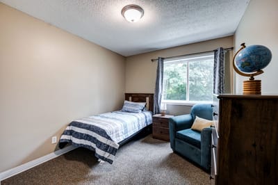 Cozy private room with a single bed and desk