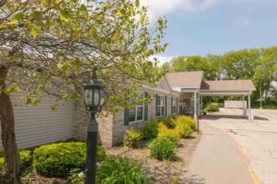 Exterior view of the assisted living facility with landscaping