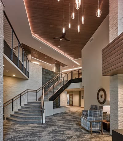 Bright interior of a senior living facility lobby.