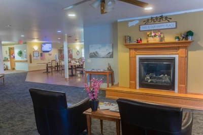 Bright common area with seating and fireplace