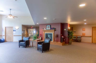 Interior common area with seating and a fireplace