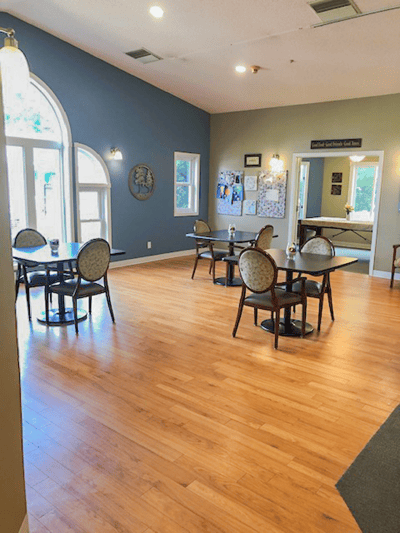 Bright common area with tables and chairs
