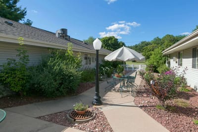 Garden area with seating and vibrant flowers