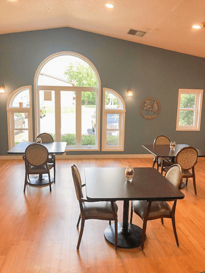 Bright dining area with tables and chairs