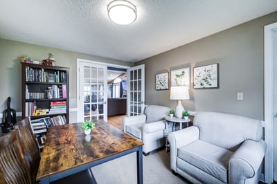 Comfortable lounge area with seating and bookshelves