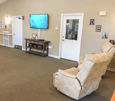 Interior common area with a television and seating