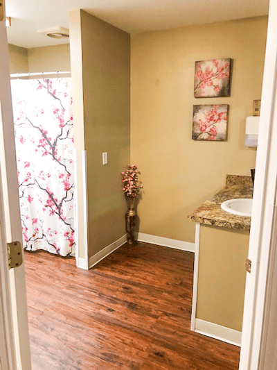 Well-lit interior of a resident's private bathroom