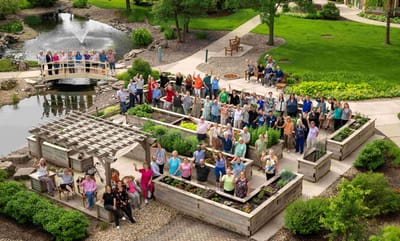 Residents and staff celebrating in a garden area