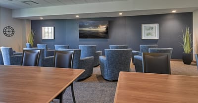 Comfortable common area with seating and artwork