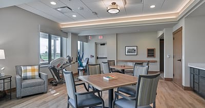 Bright common area with tables and chairs