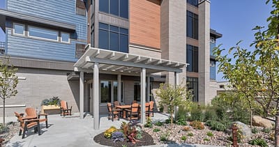 Outdoor seating area with landscaping at Cardinal View Senior Living