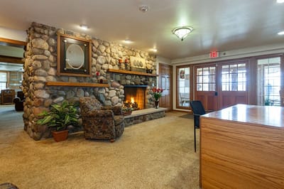 Cozy common area with a stone fireplace