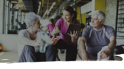 Residents engaging with staff in a fitness activity