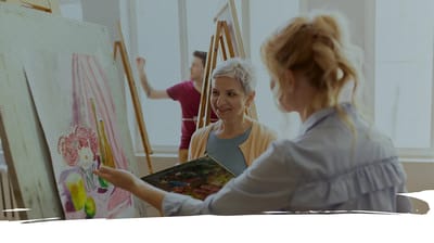 Residents painting in an art activity session