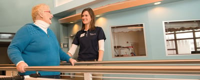 Staff assisting a resident in a supportive environment