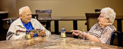 Residents enjoying a game together at a common area
