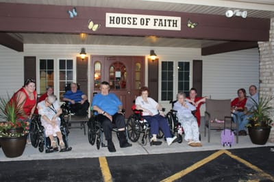 Residents and staff gathered outside the facility entrance