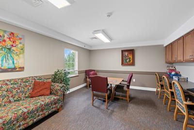 Interior living area with a colorful couch and artwork
