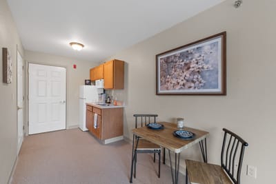 Cozy interior view of a private room with kitchen area