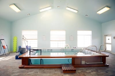 Indoor therapy pool with exercise equipment