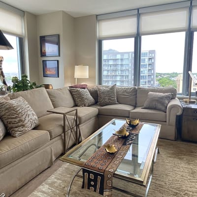 Cozy living room with large windows and comfortable seating