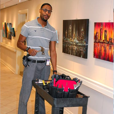 Maintenance staff member with tools in an interior space
